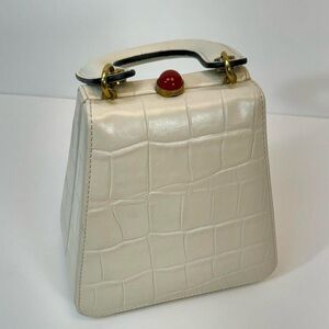 Staud Kenny cream crocodile textured leather bag with gold hardware and red top
